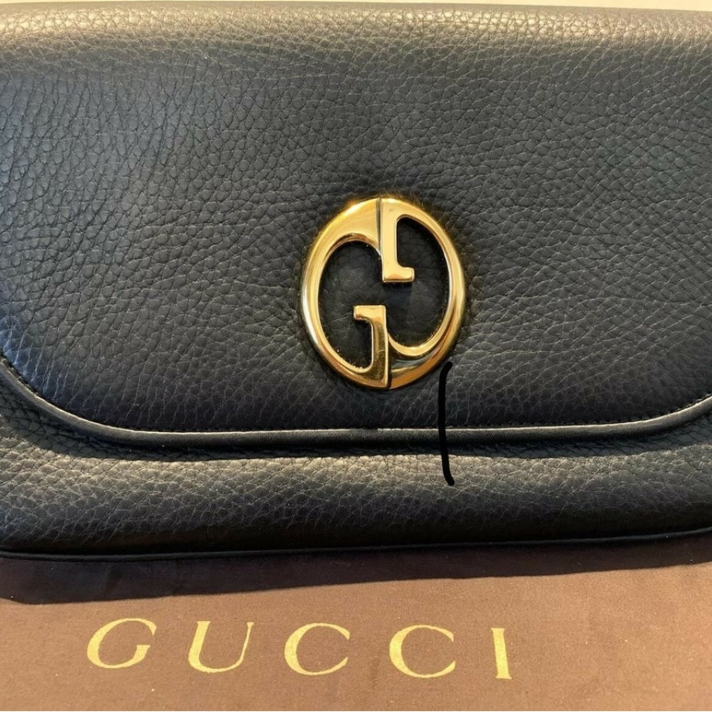 Gucci Black and Gold Clutch with Iconic GG Logo